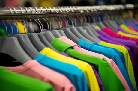 Similar jackets of different colours on a rail