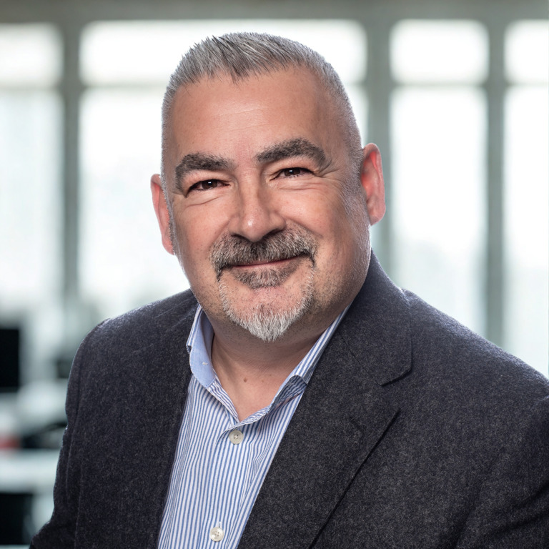 Picture of Steve Montisci, Business Development Manager, posing for the camera in a jacket and open neck shirt Picture of Steve Montisci, Business Development Manager, posing for the camera in a jacket and open neck shirt