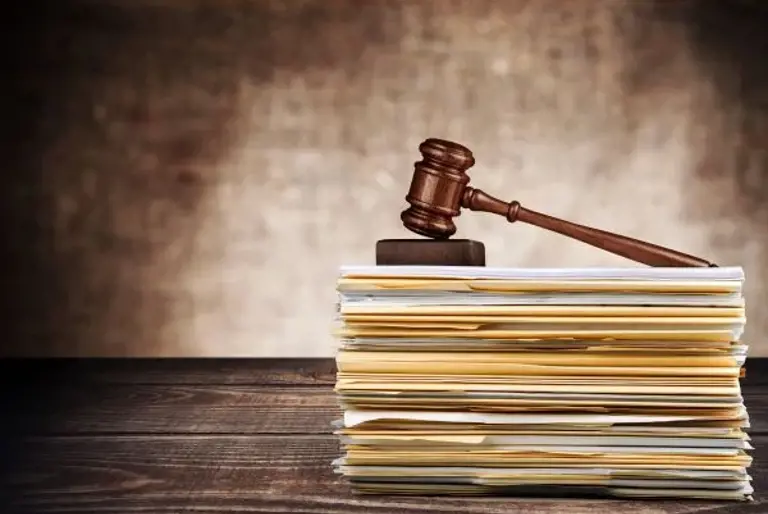 Gavel on stack of papers Gavel on stack of papers